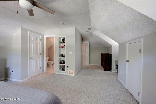 547 Deer Run Rd, New Bern, NC 28562 - unfurnished bedroom with vaulted ceiling, a textured ceiling, carpet flooring, ensuite bathroom, and baseboards