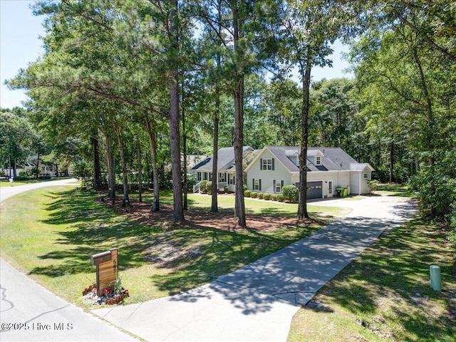 547 Deer Run Rd, New Bern, NC 28562 - view of front of property featuring concrete driveway, a front yard, and a garage