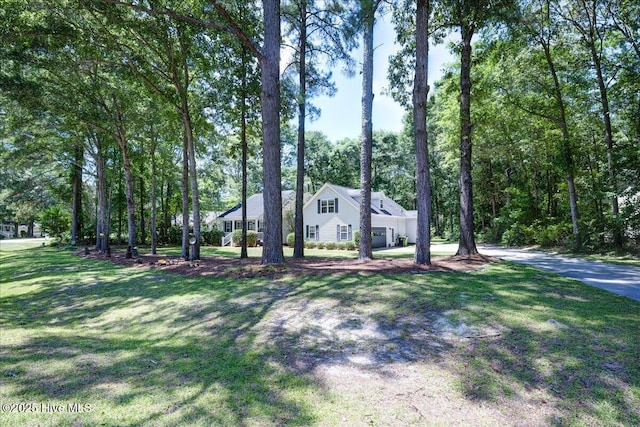 547 Deer Run Rd, New Bern, NC 28562 - view of front of property with a front lawn, an attached garage, and driveway