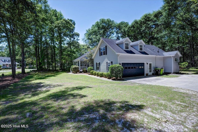 547 Deer Run Rd, New Bern, NC 28562 - view of property exterior featuring driveway, a garage, and a lawn