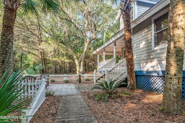 20 Fort Holmes Trl, Bald Head Island, NC 28461 - view of yard featuring stairway and covered porch