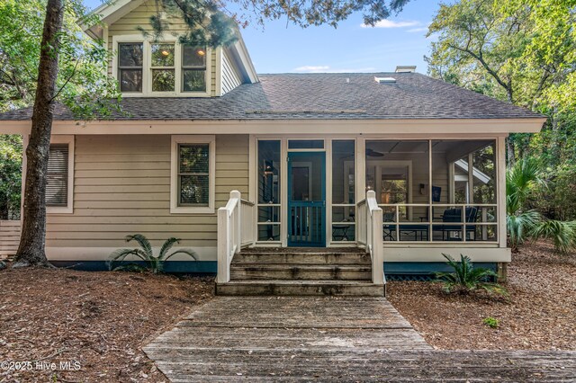 20 Fort Holmes Trl, Bald Head Island, NC 28461 - view of front of property featuring a shingled roof and a sunroom