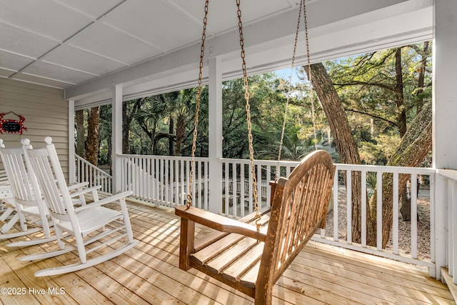 20 Fort Holmes Trl, Bald Head Island, NC 28461 - wooden deck with view of scattered trees