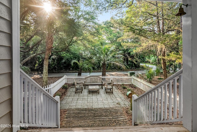 20 Fort Holmes Trl, Bald Head Island, NC 28461 - view of patio / terrace with view of wooded area