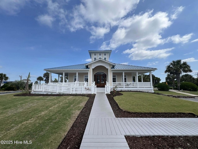 1904 E Fort Macon Rd Unit 269, Atlantic Beach, NC 28512 - farmhouse with a standing seam roof, a porch, a front yard, and metal roof