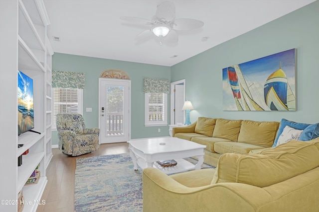 409 Womble St, Oak Island, NC 28465 - living room with a ceiling fan and wood finished floors
