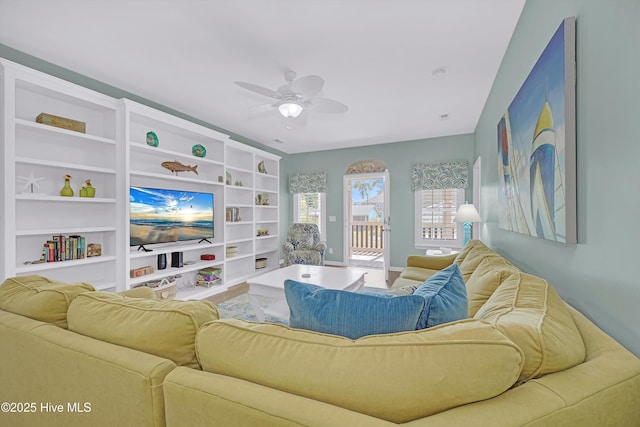 409 Womble St, Oak Island, NC 28465 - living area with a ceiling fan, built in features, and baseboards