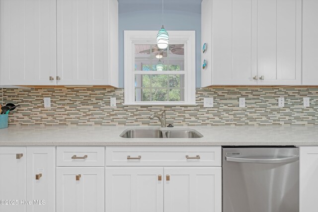 409 Womble St, Oak Island, NC 28465 - kitchen featuring dishwasher, a sink, light countertops, and white cabinets