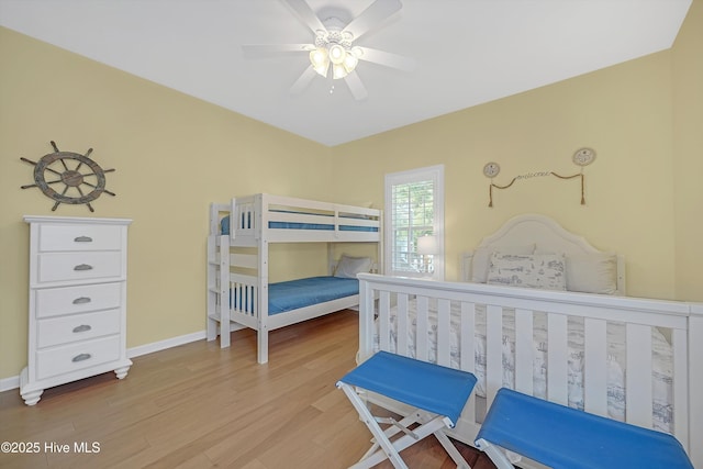 409 Womble St, Oak Island, NC 28465 - bedroom with wood finished floors, baseboards, and a ceiling fan