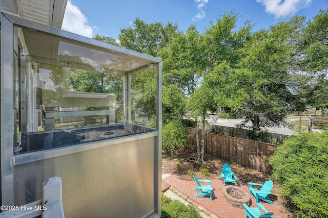 409 Womble St, Oak Island, NC 28465 - view of patio with an outdoor fire pit