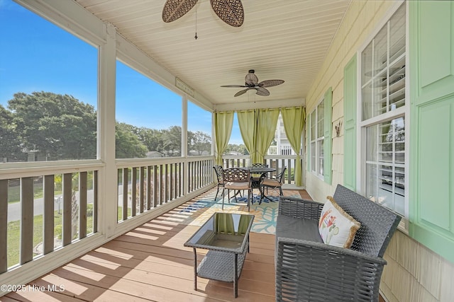 409 Womble St, Oak Island, NC 28465 - sunroom featuring a ceiling fan, plenty of natural light, and outdoor dining space