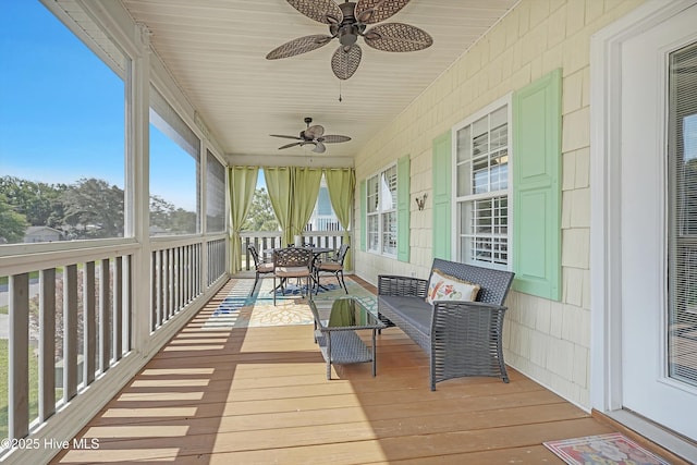 409 Womble St, Oak Island, NC 28465 - sunroom / solarium featuring a ceiling fan