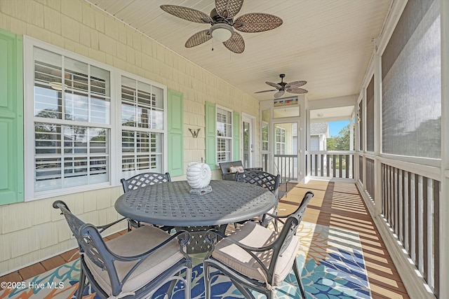 409 Womble St, Oak Island, NC 28465 - sunroom with a ceiling fan and outdoor dining area