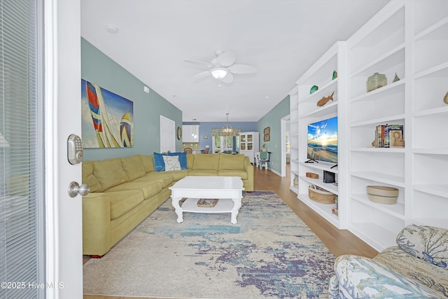 409 Womble St, Oak Island, NC 28465 - living area featuring wood finished floors, a ceiling fan, and built in features