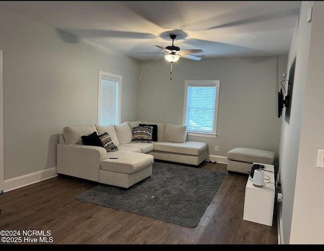 622 Williams St, Enfield, NC 27823 - living area with dark wood finished floors, baseboards, and ceiling fan
