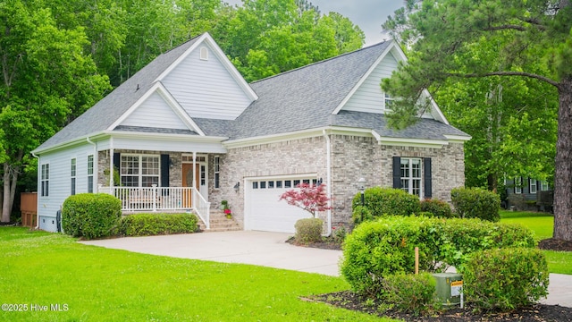 777 Marsh Rose Path NW, Calabash, NC 28467 - view of front of house featuring covered porch, a garage, a front yard, driveway, and roof with shingles