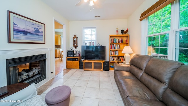 777 Marsh Rose Path NW, Calabash, NC 28467 - living area featuring ceiling fan, light tile patterned flooring, and a fireplace
