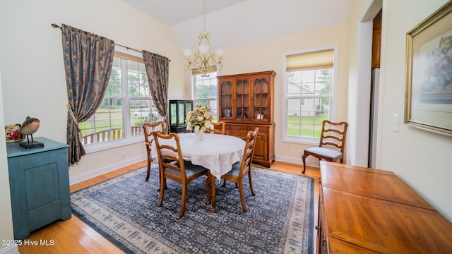 777 Marsh Rose Path NW, Calabash, NC 28467 - dining room featuring a chandelier, healthy amount of natural light, light wood-style floors, and vaulted ceiling