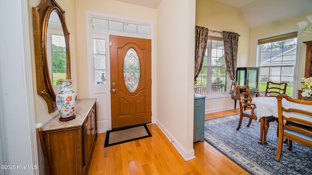 777 Marsh Rose Path NW, Calabash, NC 28467 - foyer with light wood-style flooring, baseboards, and vaulted ceiling