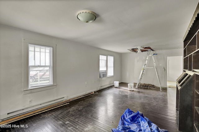 222 Evans St, Wilmington, NC 28405 - unfurnished living room with baseboard heating, wood-type flooring, and cooling unit