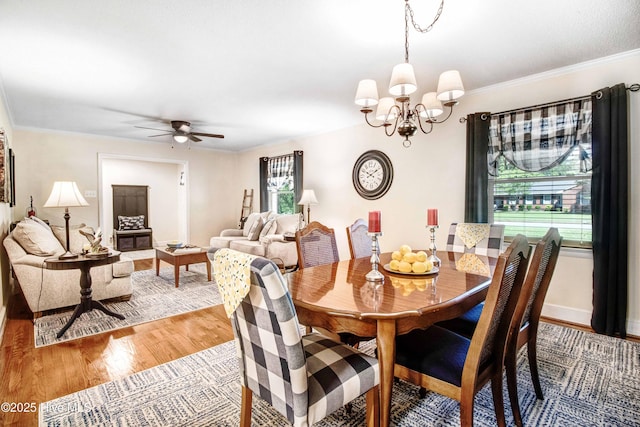 2305 Hardee Rd, Kinston, NC 28504 - dining space featuring light wood-style flooring, a chandelier, ceiling fan, and ornamental molding