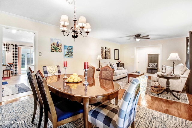 2305 Hardee Rd, Kinston, NC 28504 - dining area with light wood-style floors, ceiling fan, ornamental molding, and a chandelier