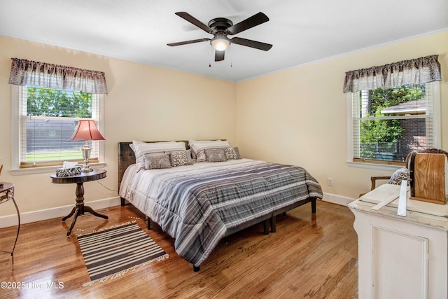 2305 Hardee Rd, Kinston, NC 28504 - bedroom featuring wood finished floors and a ceiling fan