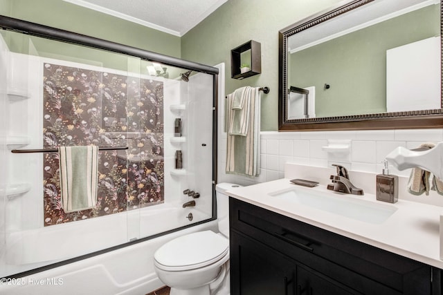 2305 Hardee Rd, Kinston, NC 28504 - bathroom with bath / shower combo with glass door, vanity, ornamental molding, tile walls, and a wainscoted wall
