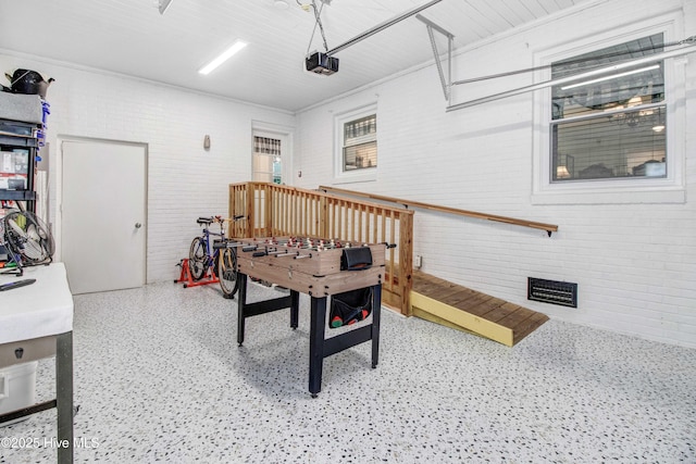 2305 Hardee Rd, Kinston, NC 28504 - rec room with brick wall and dark aggregate flooring