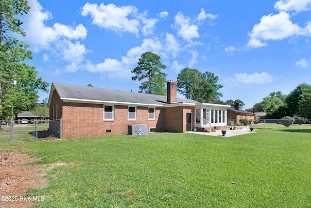 2305 Hardee Rd, Kinston, NC 28504 - back of house featuring brick siding, crawl space, a patio area, a gate, and a chimney