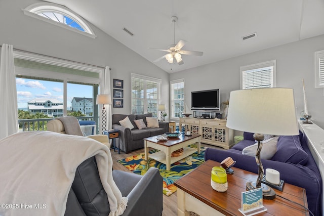 3725 Island Dr, North Topsail Beach, NC 28460 - living room with wood finished floors, a ceiling fan, and high vaulted ceiling