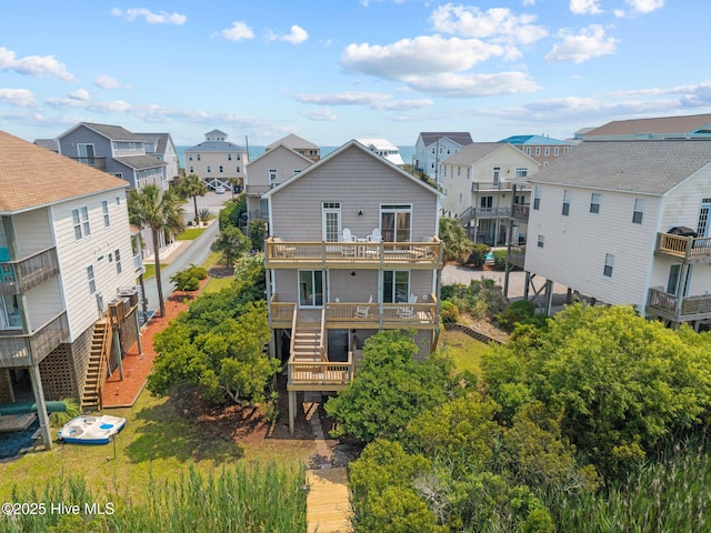 3725 Island Dr, North Topsail Beach, NC 28460 - rear view of property with a residential view, stairway, and a deck