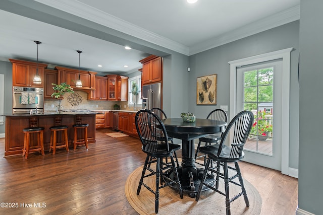1086 Ferry Landing Dr SW, Supply, NC 28462 - dining room featuring dark wood-type flooring, baseboards, crown molding, and recessed lighting