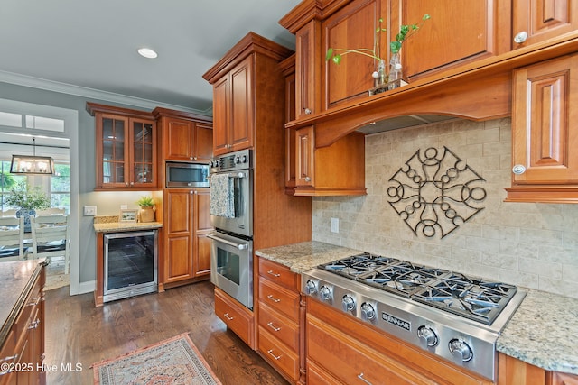 1086 Ferry Landing Dr SW, Supply, NC 28462 - kitchen featuring wine cooler, appliances with stainless steel finishes, brown cabinets, ornamental molding, and light stone countertops