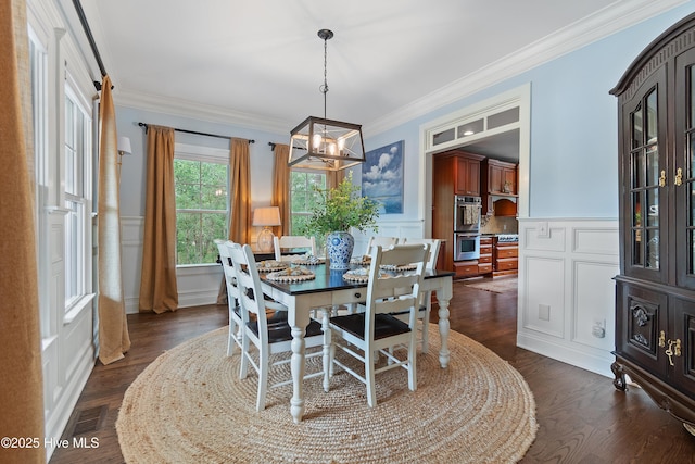 1086 Ferry Landing Dr SW, Supply, NC 28462 - dining space featuring a decorative wall, a chandelier, crown molding, dark wood finished floors, and wainscoting