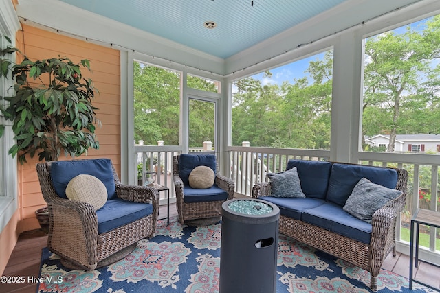 1086 Ferry Landing Dr SW, Supply, NC 28462 - sunroom featuring an outdoor hangout area and view of wooded area