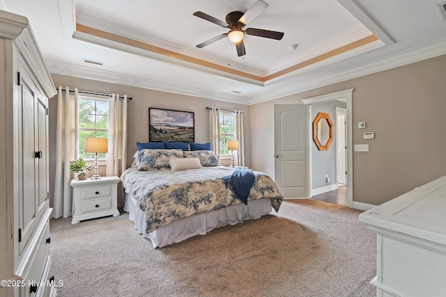 1086 Ferry Landing Dr SW, Supply, NC 28462 - bedroom featuring a raised ceiling, multiple windows, light colored carpet, and crown molding