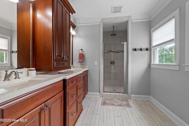 1086 Ferry Landing Dr SW, Supply, NC 28462 - bathroom with double vanity, a shower stall, crown molding, healthy amount of natural light, and wood finished floors
