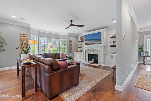 1086 Ferry Landing Dr SW, Supply, NC 28462 - living room featuring a ceiling fan, plenty of natural light, a stone fireplace, wood finished floors, and ornamental molding