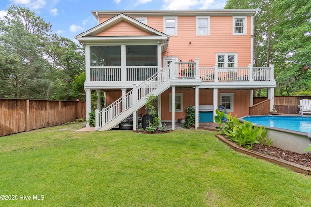 1086 Ferry Landing Dr SW, Supply, NC 28462 - rear view of house with stairs, a wooden deck, a sunroom, and board and batten siding