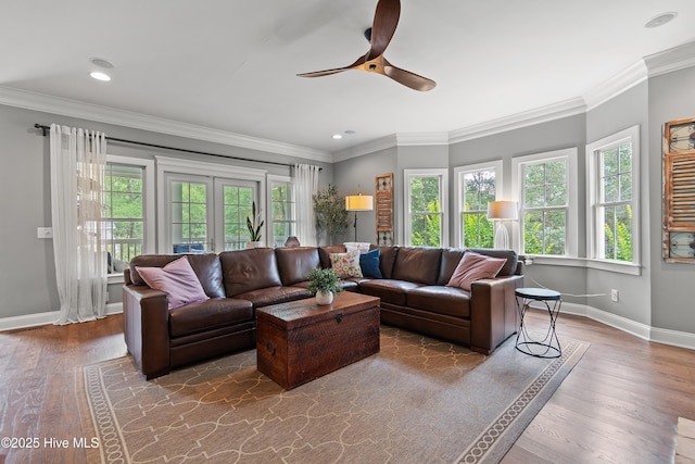 1086 Ferry Landing Dr SW, Supply, NC 28462 - living area featuring ceiling fan, baseboards, wood finished floors, ornamental molding, and recessed lighting