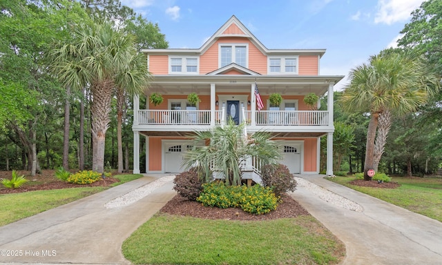 1086 Ferry Landing Dr SW, Supply, NC 28462 - coastal inspired home featuring concrete driveway, a garage, and covered porch