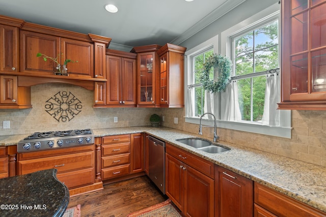 1086 Ferry Landing Dr SW, Supply, NC 28462 - kitchen featuring stainless steel appliances, a sink, crown molding, light stone counters, and glass insert cabinets