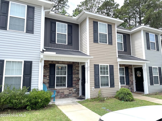 219 Grove Ln, Havelock, NC 28532 - view of property with stone siding, board and batten siding, and covered porch