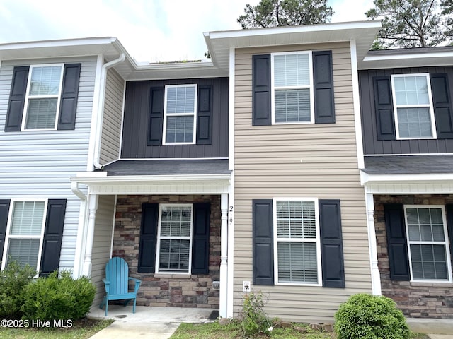 219 Grove Ln, Havelock, NC 28532 - townhome / multi-family property featuring stone siding, board and batten siding, and a porch