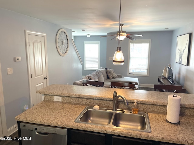 219 Grove Ln, Havelock, NC 28532 - kitchen featuring stainless steel dishwasher, a sink, healthy amount of natural light, and light countertops