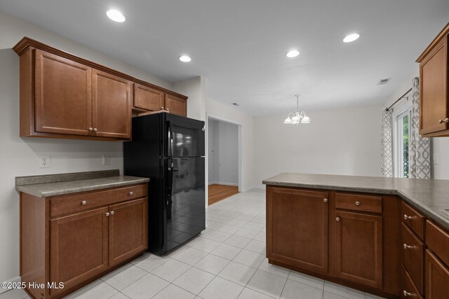 123 S Park Ln, Newport, NC 28570 - kitchen with freestanding refrigerator, a chandelier, baseboards, light tile patterned floors, and recessed lighting