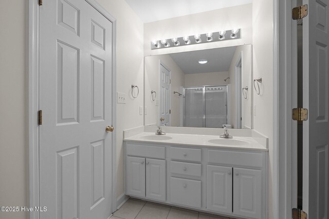 123 S Park Ln, Newport, NC 28570 - bathroom featuring double vanity, a shower with shower door, and tile patterned flooring