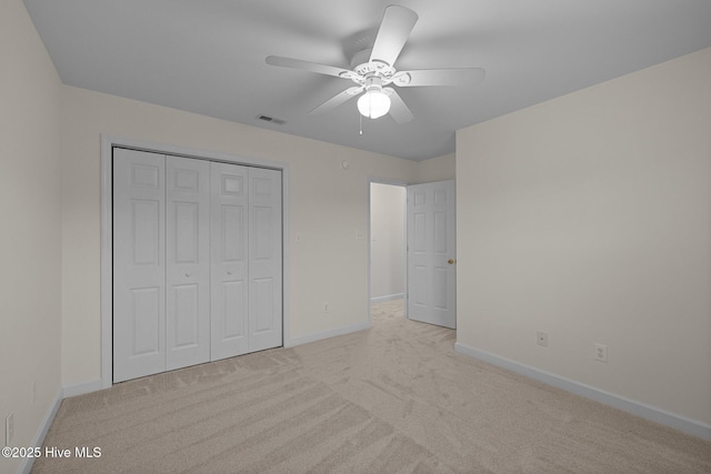 123 S Park Ln, Newport, NC 28570 - unfurnished bedroom with baseboards, carpet flooring, a closet, and a ceiling fan