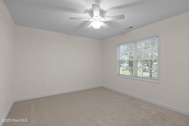 123 S Park Ln, Newport, NC 28570 - spare room featuring light carpet, a ceiling fan, and baseboards